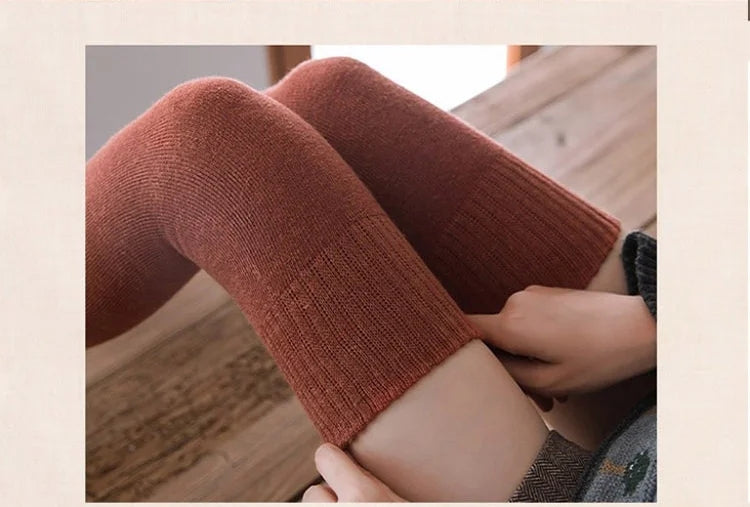 A pair of warm Arenzza thigh-high socks long stockings in cozy fabric, extending up the legs for stylish winter wear.