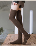 A pair of warm Arenzza thigh-high socks, long stockings made of soft, cozy fabric for comfortable wear.