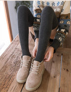 A pair of warm thigh-high socks from Arenzza, featuring long, cozy stocking design perfect for cold weather wear.