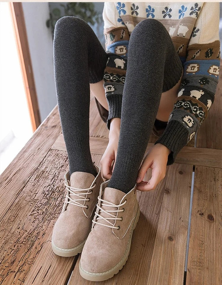 A pair of warm thigh-high socks from Arenzza, featuring long, cozy stocking design perfect for cold weather wear.