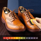 Arenzza leather repair cream liquid shoe polish bottle with applicator brush for restoring and shining leather shoes and accessories.