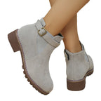 A pair of women's solid black elastic low heel ankle boots by Arenzza, featuring sleek design and comfortable low heel.