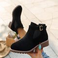 Women's solid elastic low heel ankle boots by Arenzza, featuring a sleek design and comfortable fit in black leather.