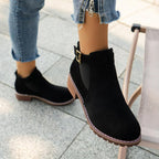 A pair of women's solid elastic low heel ankle boots by Arenzza featuring a sleek design and comfortable fit.