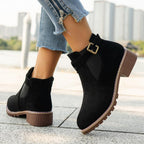Women's solid elastic low heel ankle boots by Arenzza featuring sleek design and comfortable fit in black leather.