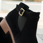 A pair of women's solid black elastic low heel ankle boots by Arenzza, featuring a sleek design and ankle-high cut.