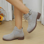 A pair of women's solid black elastic low heel ankle boots by Arenzza, featuring a sleek design and comfortable fit.