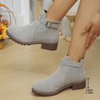 Women's solid elastic low heel ankle boots by Arenzza, showcasing sleek black leather with a comfortable elastic ankle design.