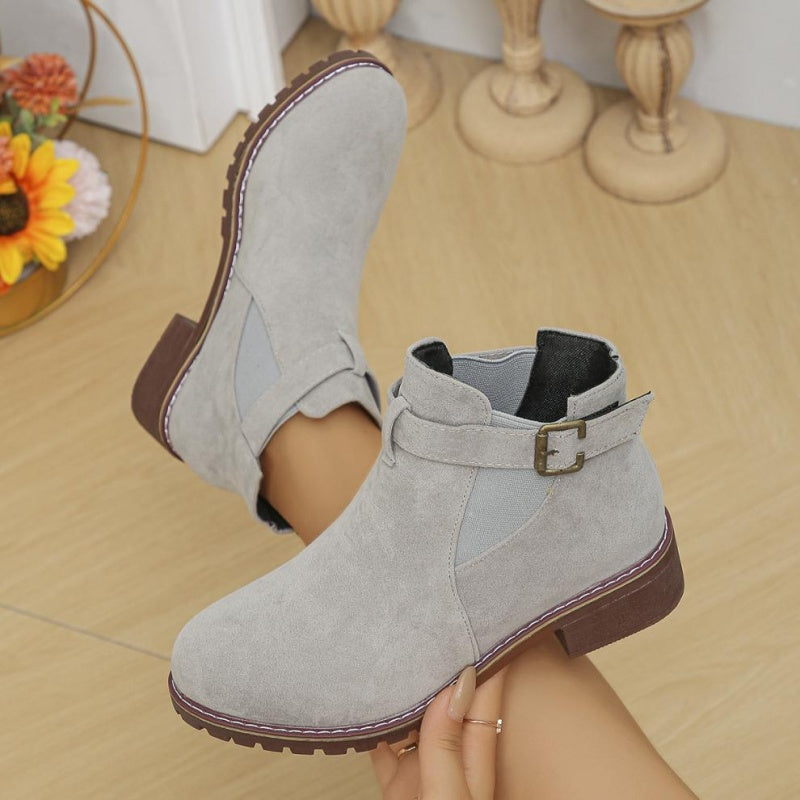 Women's solid elastic low heel ankle boots by Arenzza, featuring a sleek design with ankle height and comfortable low heel.