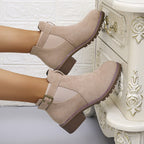 Women's solid elastic low heel ankle boots by Arenzza, showcasing black slip-on boots with elastic sides and low heel design.