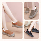 A pair of women's plush cozy slip-on shoes by Arenzza in soft, warm fabric perfect for indoor comfort and casual wear.