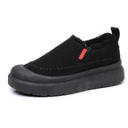 A pair of Arenzza women's plush cozy slip-on shoes in soft, warm fabric with a comfortable design.