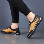 A pair of men's slip-on shoes by Arenzza, lightweight and breathable, shown in a natural side view.