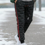 A pair of Arenzza men's thickened windproof warm trousers with a dark, insulated design suitable for cold weather.