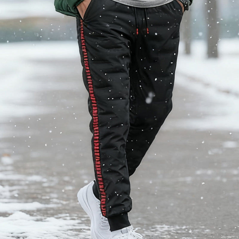 A pair of Arenzza men's thickened windproof warm trousers with a dark, insulated design suitable for cold weather.