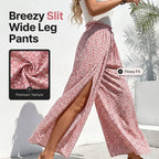A woman wears Arenzza women's smocked waist wide-leg pants with slit, showcasing flowing fabric and relaxed fit.