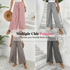 A pair of women's Arenzza smocked waist wide-leg pants with side slits, shown hanging against a neutral background.