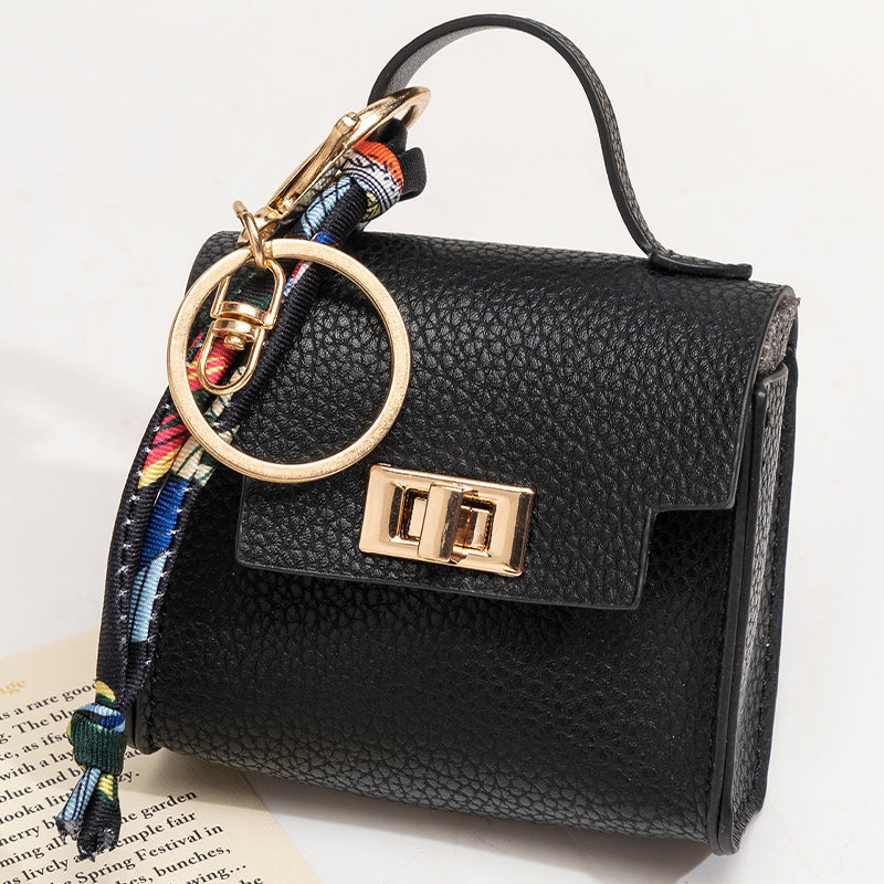 Arenzza mini keychain coin purse in soft fabric with a zipper closure, attached to a keyring for easy carrying and organization.