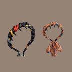 Aarenza pretty everyday wrap headband with comb teeth, featuring a soft fabric design and secure fit for daily wear.