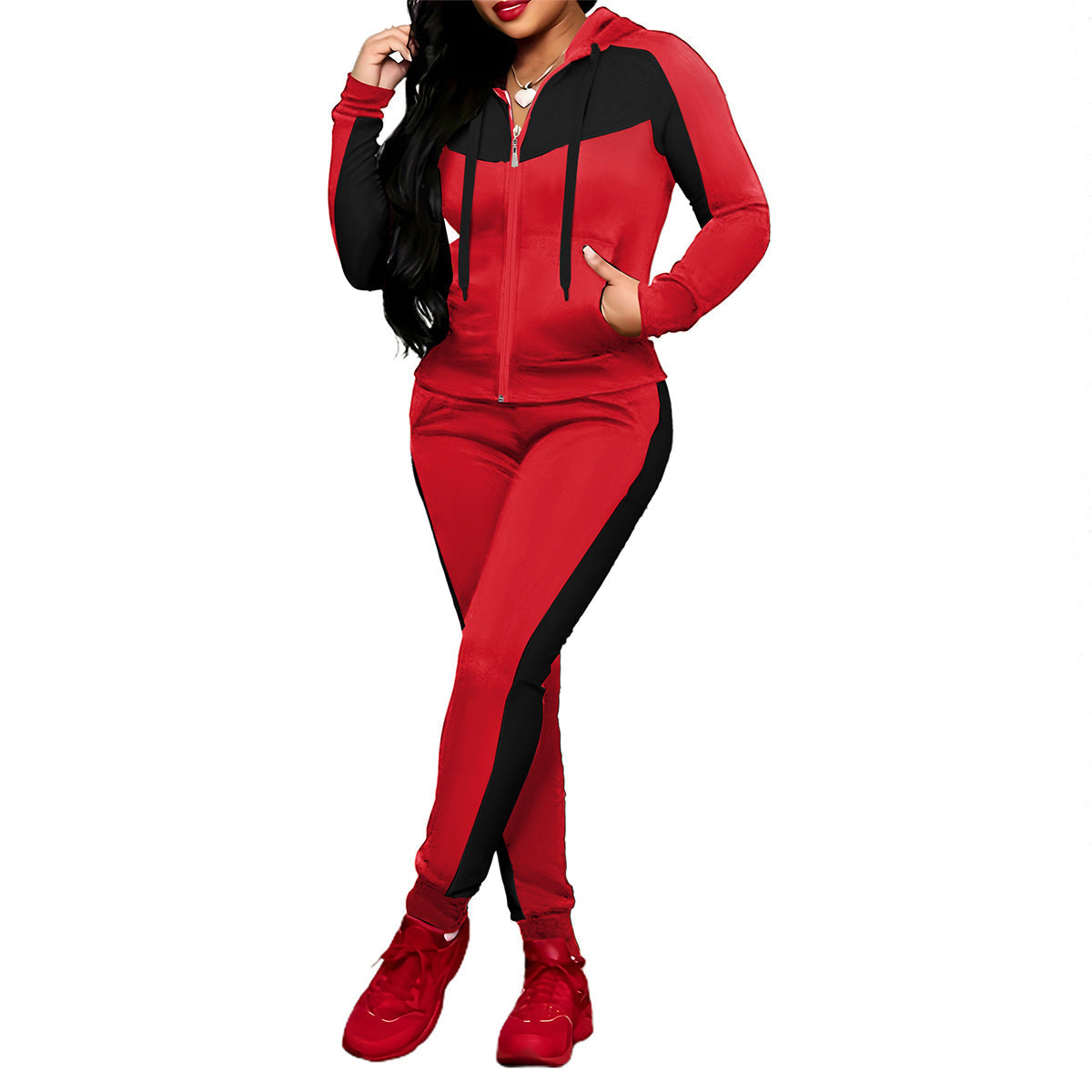 A woman wearing a stylish Arenzza women's 2-piece color-block tracksuit set, featuring vibrant contrasting colors and a comfortable fit.