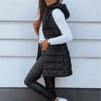Aarenza Women's zip-up long puffer vest in black, showcasing a stylish and insulated outerwear design for cold weather.