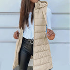 A women's Arenzza long puffer vest with a zip-up front, featuring a sleek, padded design for stylish warmth and comfort.