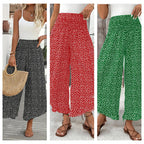A woman wears black high waist wide-leg pants from Arenzza, showcasing their flowy, slimming, and comfortable fit.