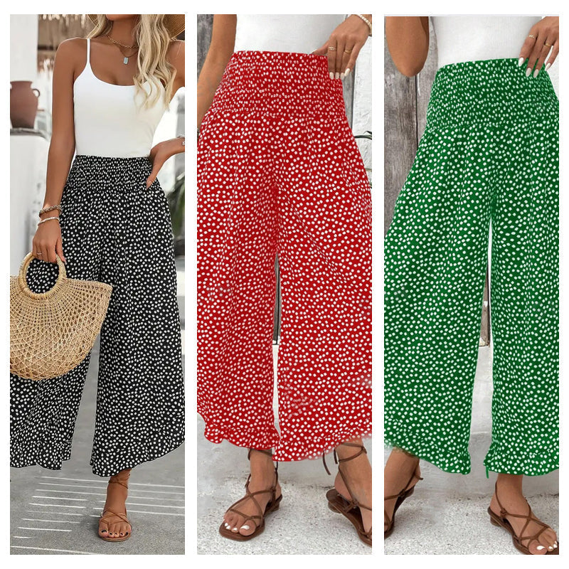 A woman wears black high waist wide-leg pants from Arenzza, showcasing their flowy, slimming, and comfortable fit.