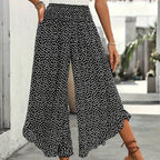 A woman wearing Arenzza high waist wide-leg pants showcasing their flowy, comfortable, and chic design in a stylish outfit.