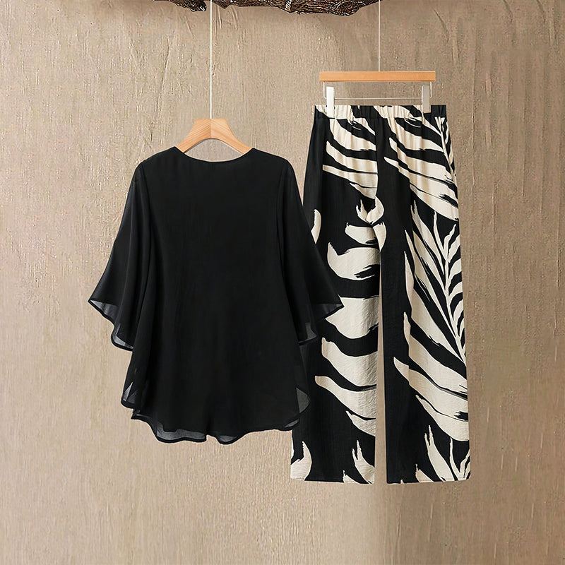 Arenzza women's elegant flowy top and printed pants set, stylish clothing with a relaxed fit and vibrant pattern, ideal for casual wear.