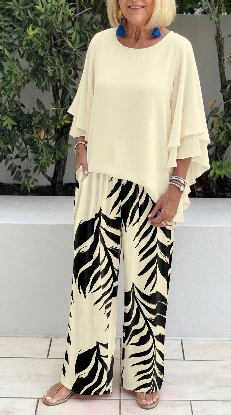 Women's elegant flowy top and printed pants set by Arenzza, featuring a stylish, comfortable clothing ensemble with a relaxed fit.