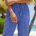 A pair of women's plaid Capri pants in green and white from Arenzza, perfect for summer casual wear.