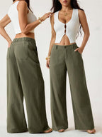 A woman wearing lightweight cotton-linen palazzo pants from Arenzza, summer classical style, in a relaxed, breezy fit.
