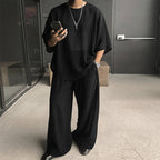 A men's T-shirt and wide-leg pants 2-piece set by Arenzza, featuring a casual, trendy style in a comfortable fabric.