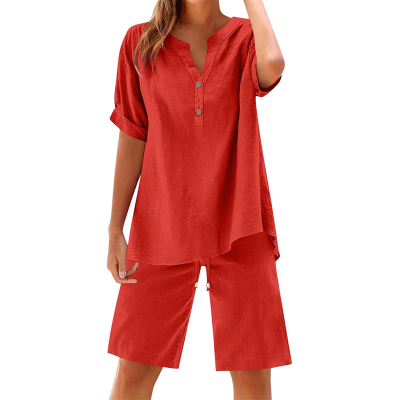 A woman wearing a white cotton linen 2-piece outfit set by Arenzza, featuring a relaxed top and matching wide-leg pants.