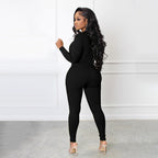 A solid color Arenzza half zip seamless jumpsuit displayed on a hanger, showcasing its sleek, fitted design and smooth fabric.