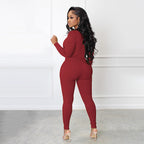 A beige solid color half zip seamless jumpsuit from Arenzza, styled as a comfortable, fitted one-piece clothing outfit.