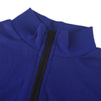 Awoman wearing an Arenzza solid color half zip seamless jumpsuit, full-length, fitted style, shown from the front.