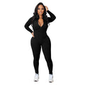 A woman wearing a solid color Arenzza seamless half zip jumpsuit, showcasing its fitted design and soft fabric.