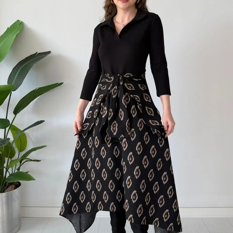 Aarenza tie-waist fit and flare midi dress in a stylish, flowing design displayed on a hanger with a neutral background.