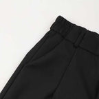 A woman wearing Arenzza women's high-waist dress pants, showcasing the tailored fit and sleek style in a professional setting.