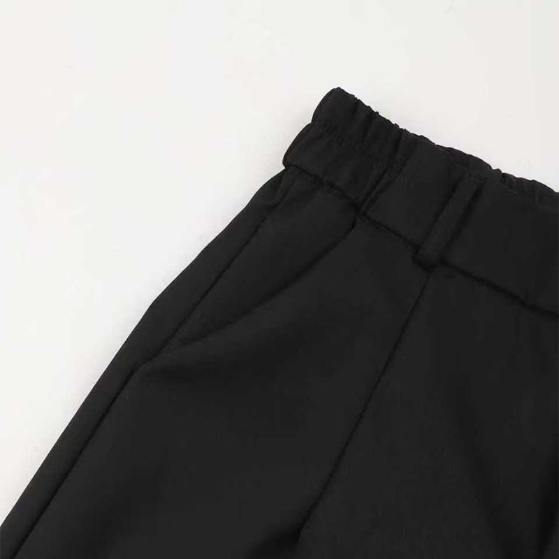 A woman wearing Arenzza women's high-waist dress pants, showcasing the tailored fit and sleek style in a professional setting.