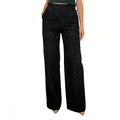 A pair of high-waist glitter straight-leg trousers from Arenzza, featuring shiny fabric and tailored fit, displayed on a hanger.