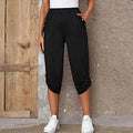 Women's casual elastic waist Capri pants in lightweight fabric, beige color, with a relaxed fit and cropped length.