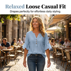 A woman wears a solid color V-neck top from Arenzza, casual clothing with a relaxed fit, shown in a natural pose.