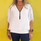 A women's Arenzza chiffon zip-up neck casual top with a relaxed fit and lightweight fabric, displayed on a hanger.