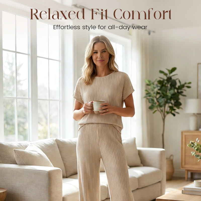 A woman wearing Arenzza's ribbed knit top and wide-leg pants set, featuring a fitted ribbed top and flowing wide-leg pants.