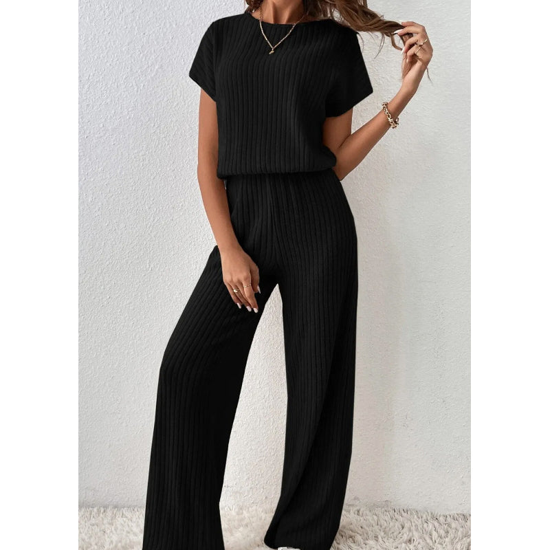 A woman wearing Arenzza's ribbed knit top and wide-leg pants set, showcasing a stylish and comfortable clothing ensemble.