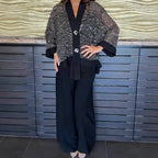 Women's V-neck sequin cardigan and wide-leg pants 2-piece set by Arenzza, featuring shimmering sequins and comfortable fit.