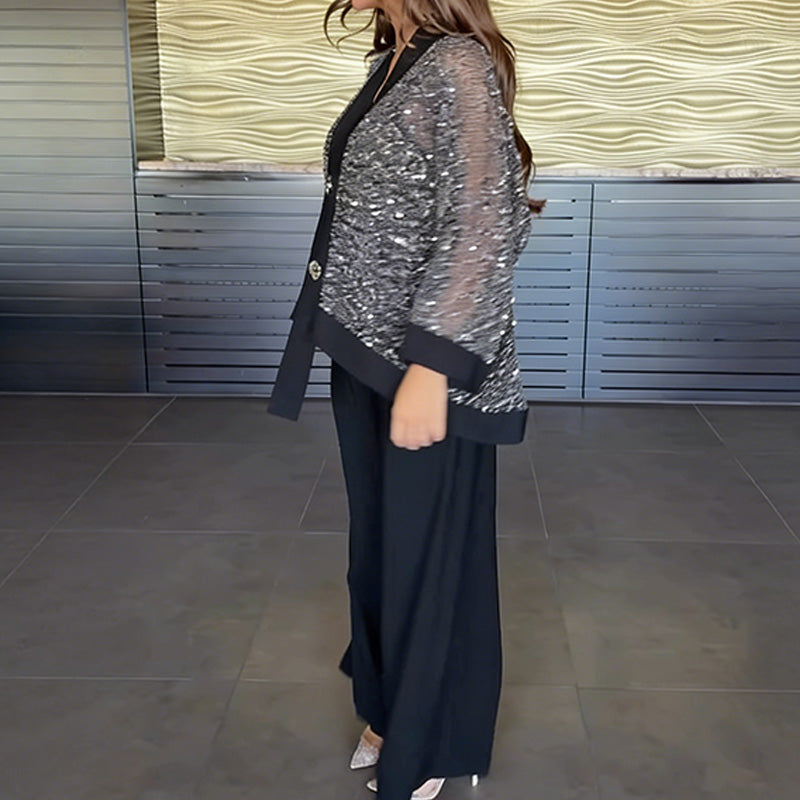 A woman wears the Arenzza women's V-neck sequin cardigan and wide-leg pants 2-piece set, showcasing the stylish, shimmering fabric.